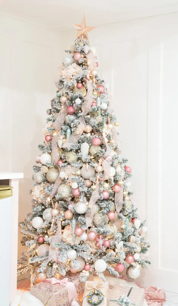 pastel Christmas tree with vertically draped ribbon and lots of pink.