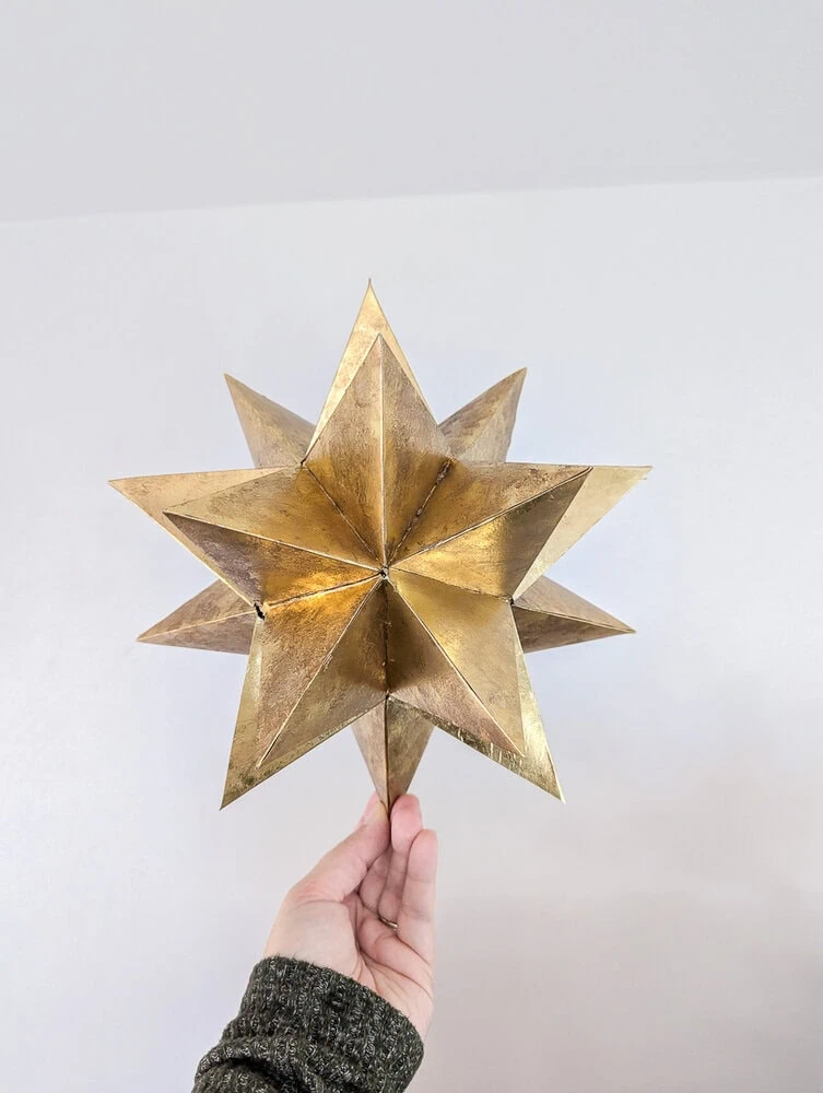 holding up my diy gold 3d Christmas tree star.