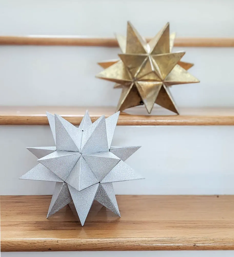DIY silver Christmas tree star next to gold star I found at an estate sale.