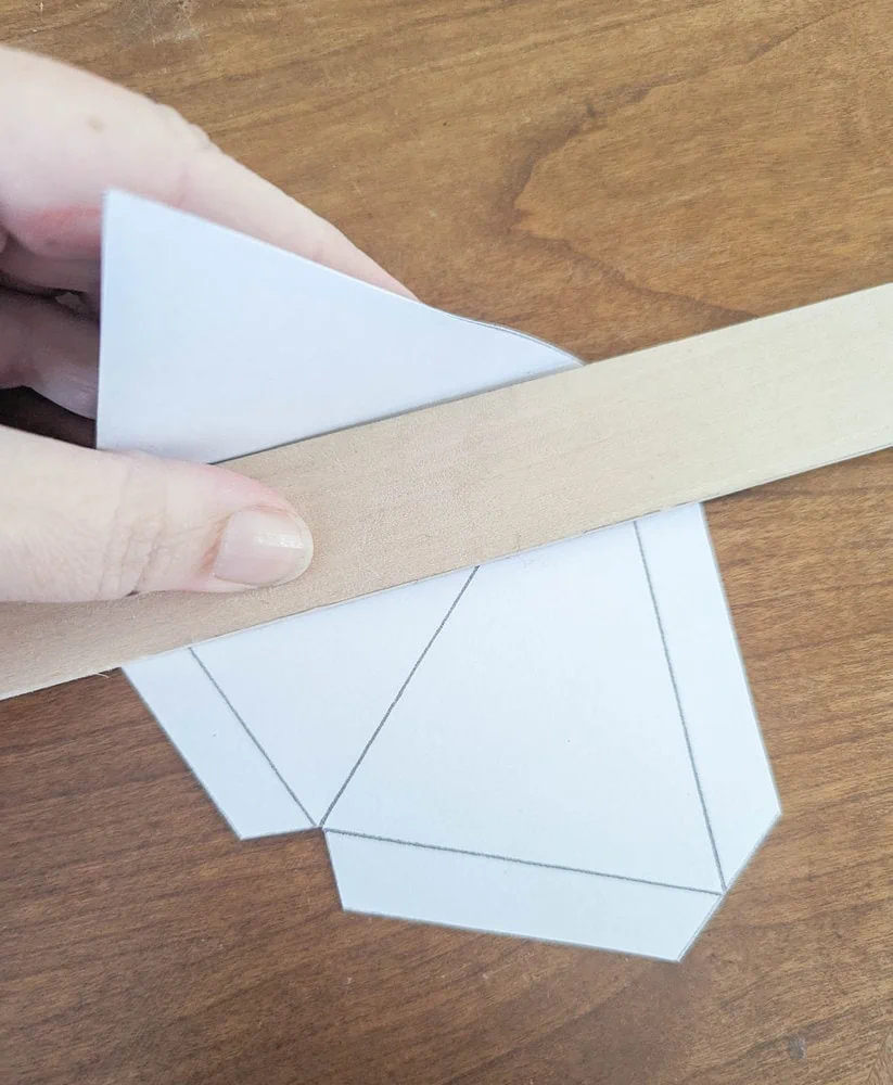 folding star template next to ruler.