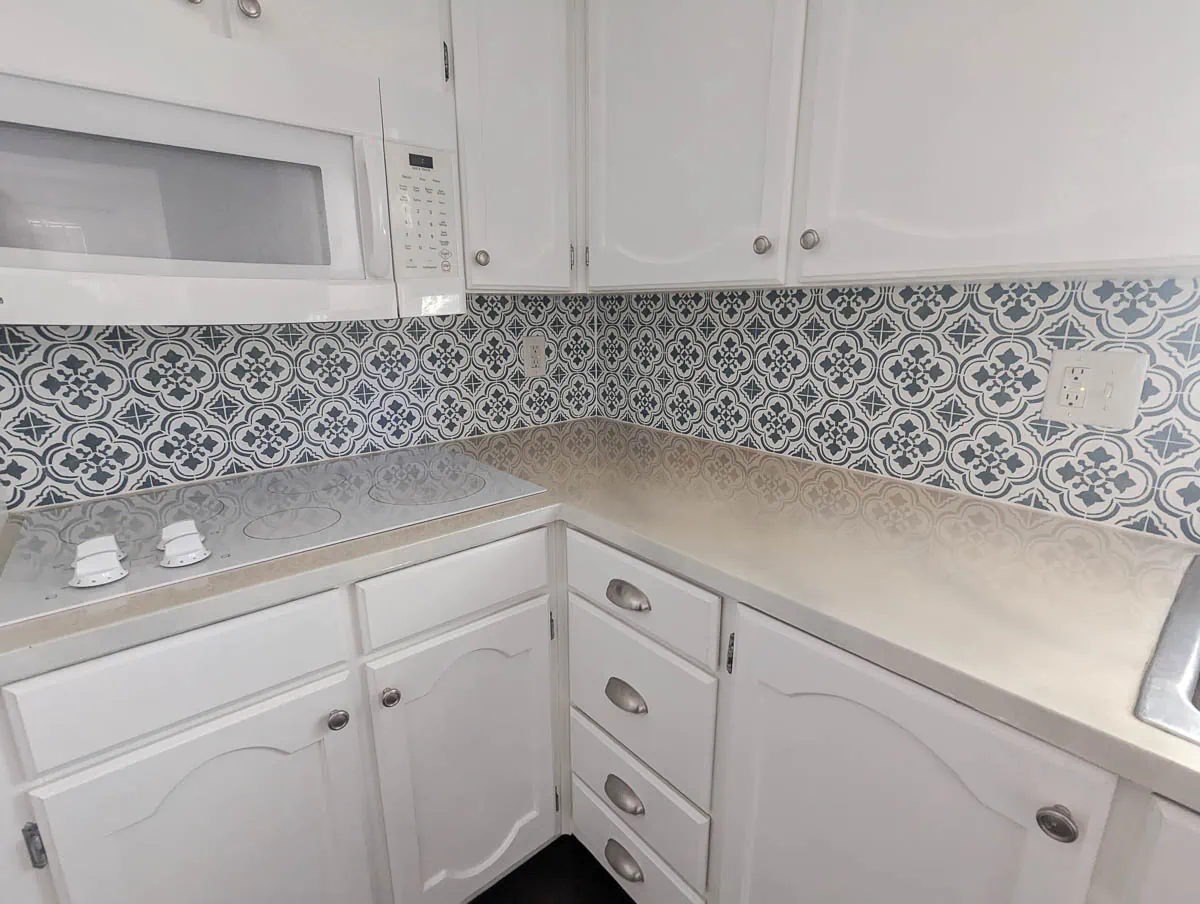 corner of kitchen showing yellowed white countertops.