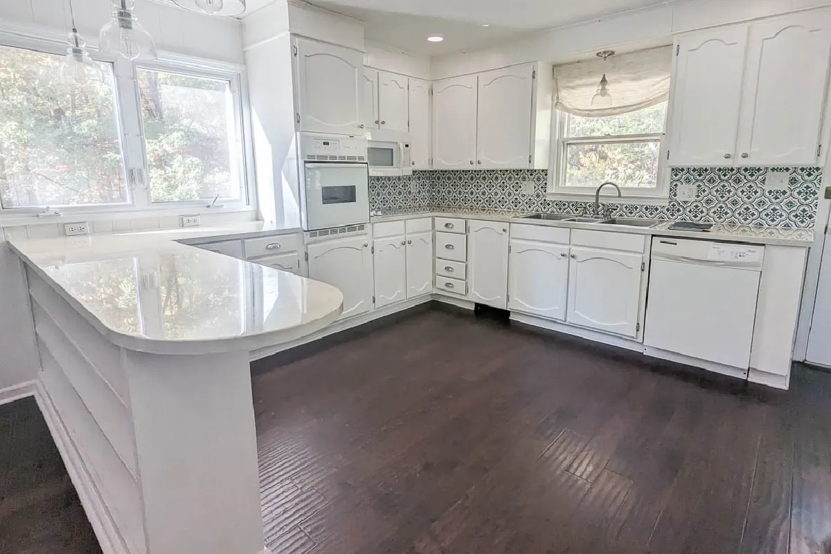 white kitchen with white painted countertops.