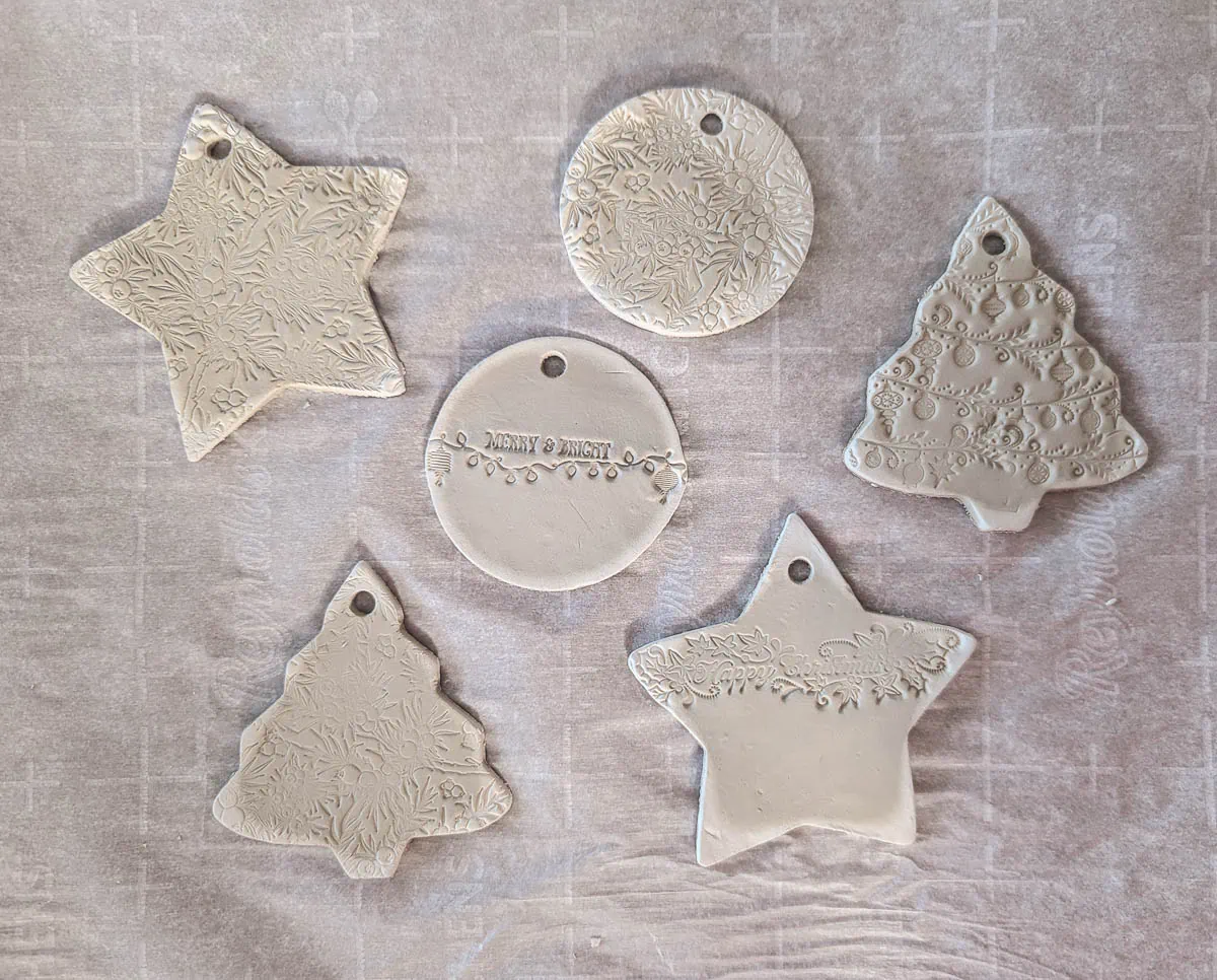 air dry clay ornaments as they are drying with darker centers and whiter edges.