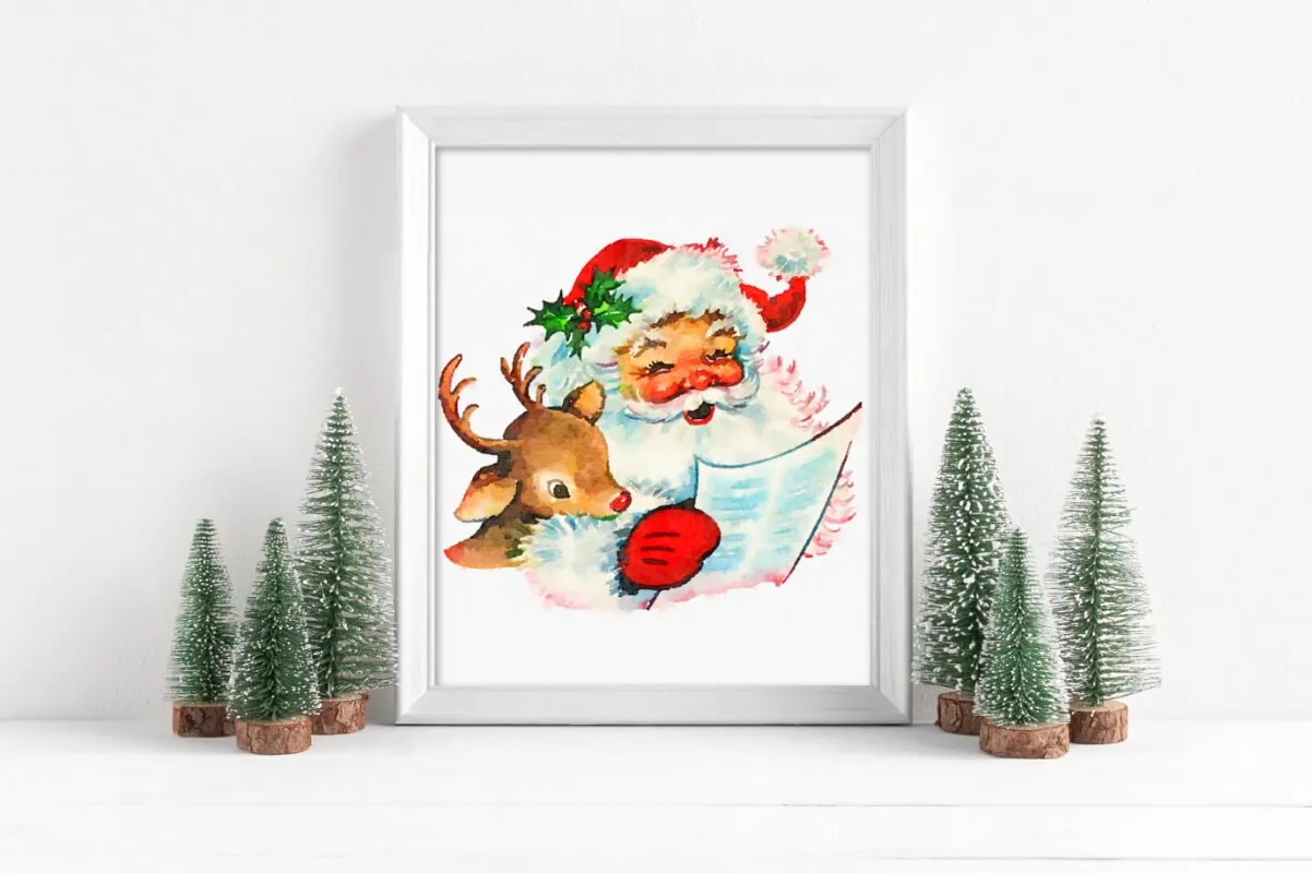 vintage Santa with Rudolph printable framed next to bottle brush trees.