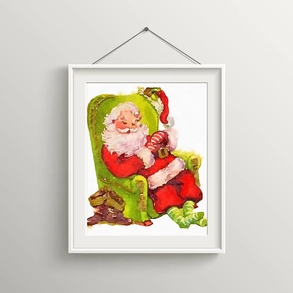 Santa sitting in chair in frame.