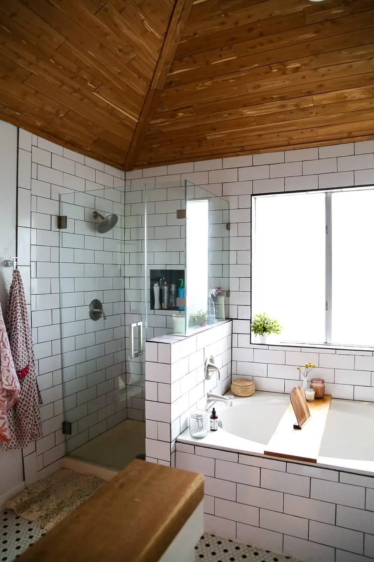 bathroom with wood ceiling and subway tile