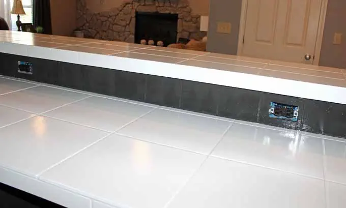 white painted tile countertop.