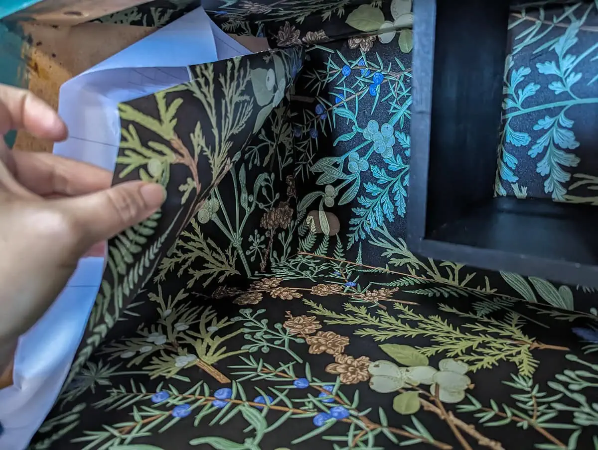 removing the backing to put peel adn stick wallpaper in furniture.
