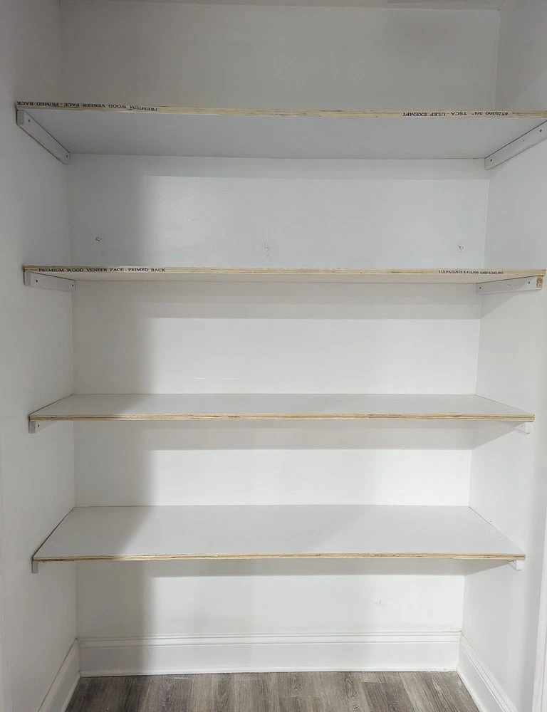 four basic shelves in closet.