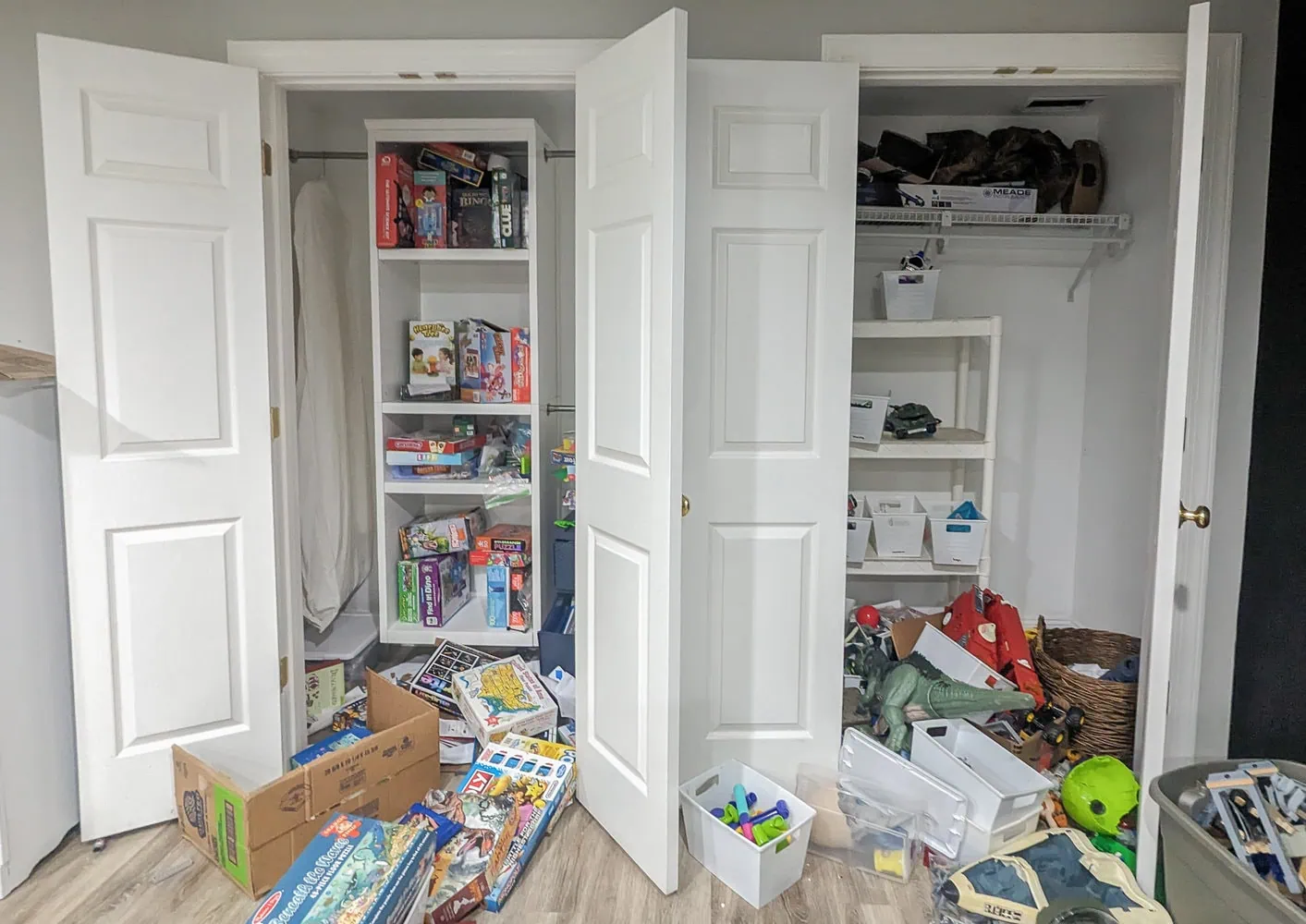 two messy closets with toys spilling into the floor.