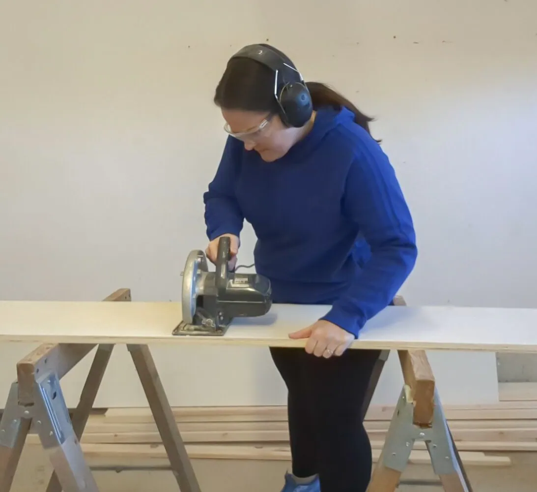 cutting shelf board with circular saw.