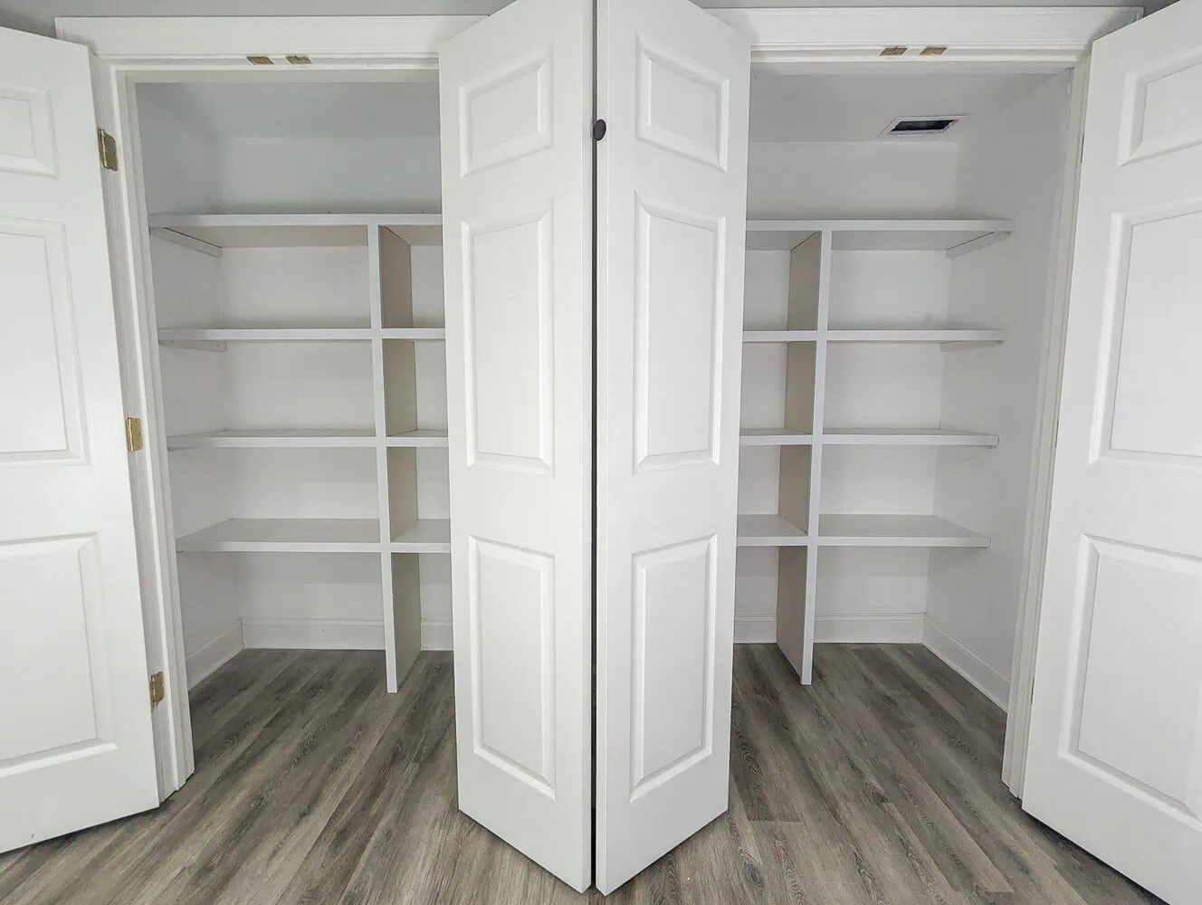 two closets with finished closet shelves.