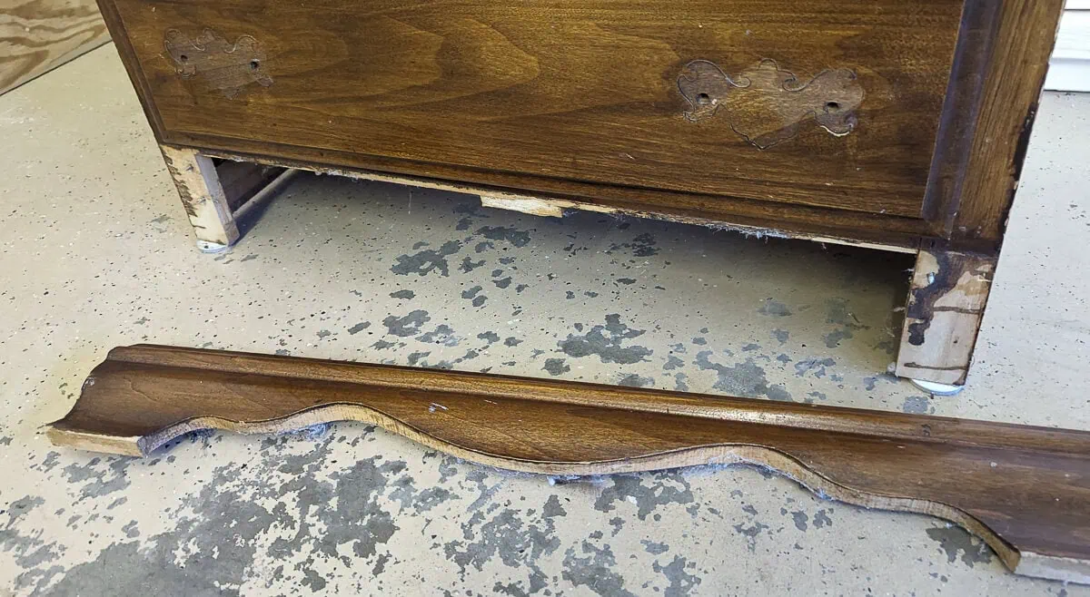 removing the wood trim at the bottom of the furniture.