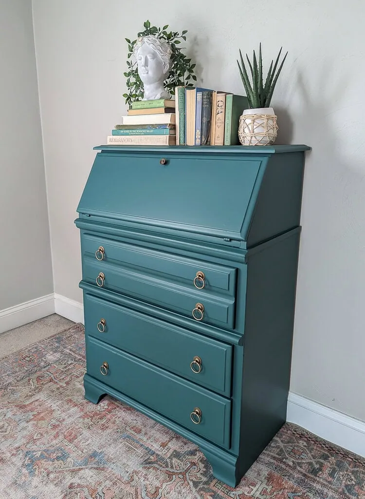 finished secretary desk with green paint and brass hardware.