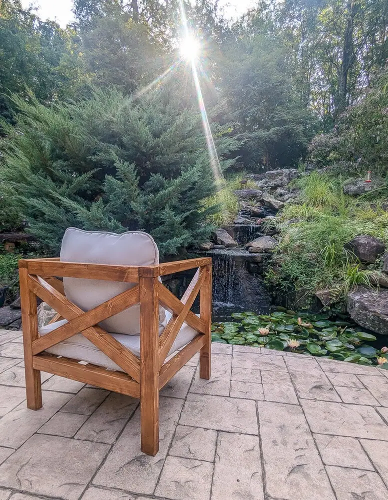 DIY wooden outdoor chair with X back and sides.