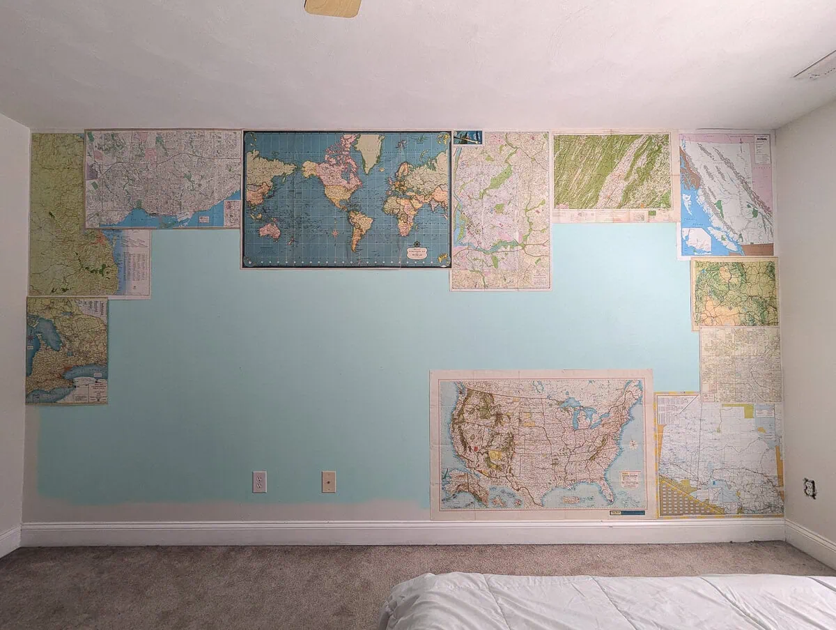 filling in wall with maps.