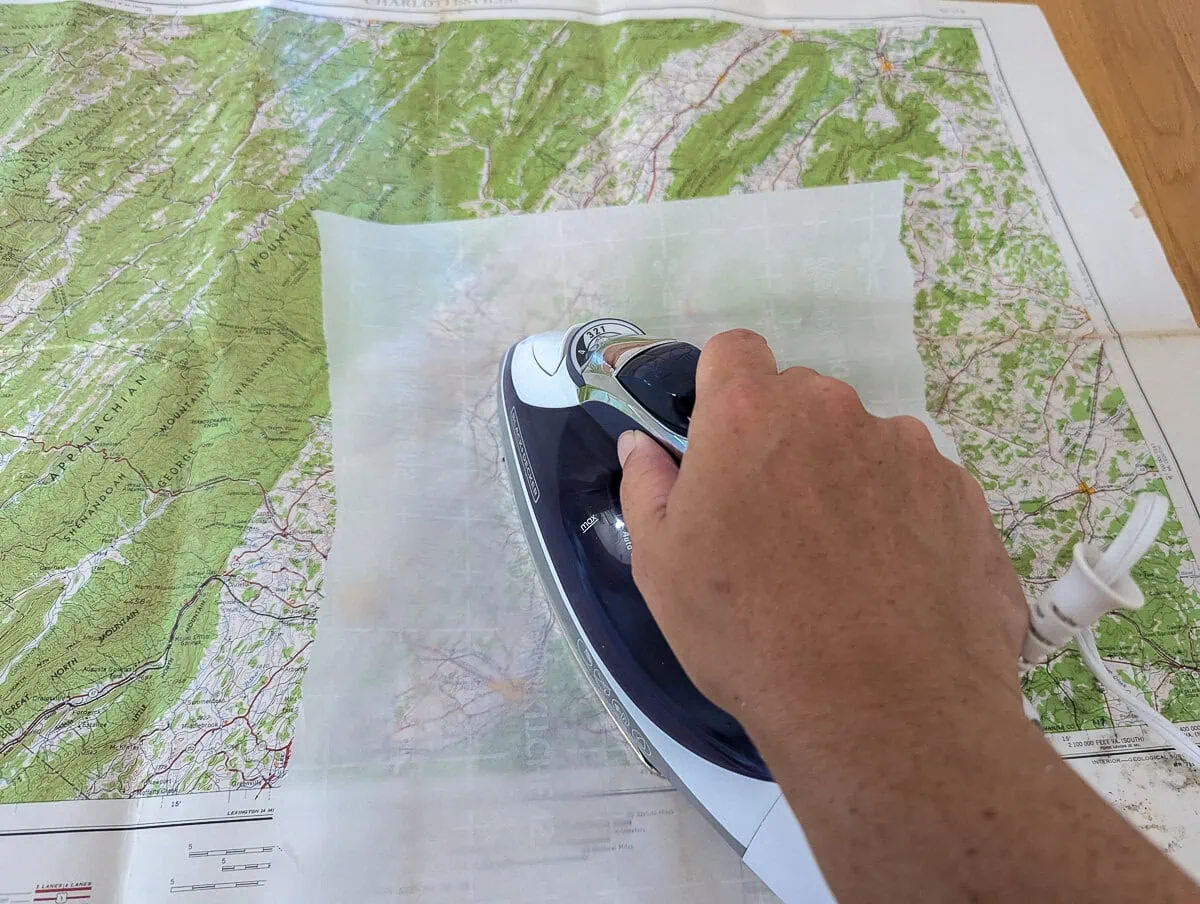 ironing wrinkles out of map.