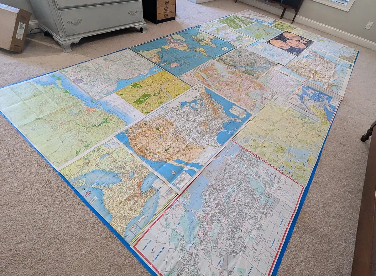 laying out maps on floor.