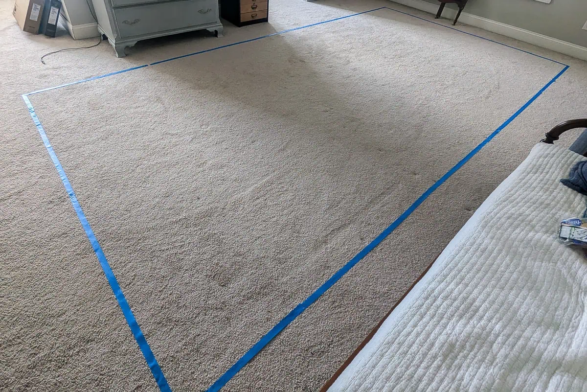 tape outline of wall on floor.