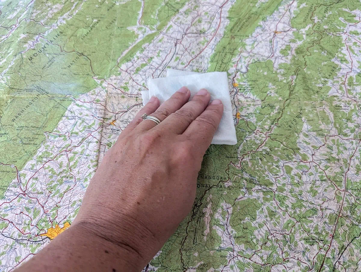 wiping down wrinkles with damp paper towel.