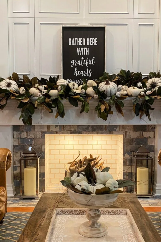 fall mantel with magnolia garland