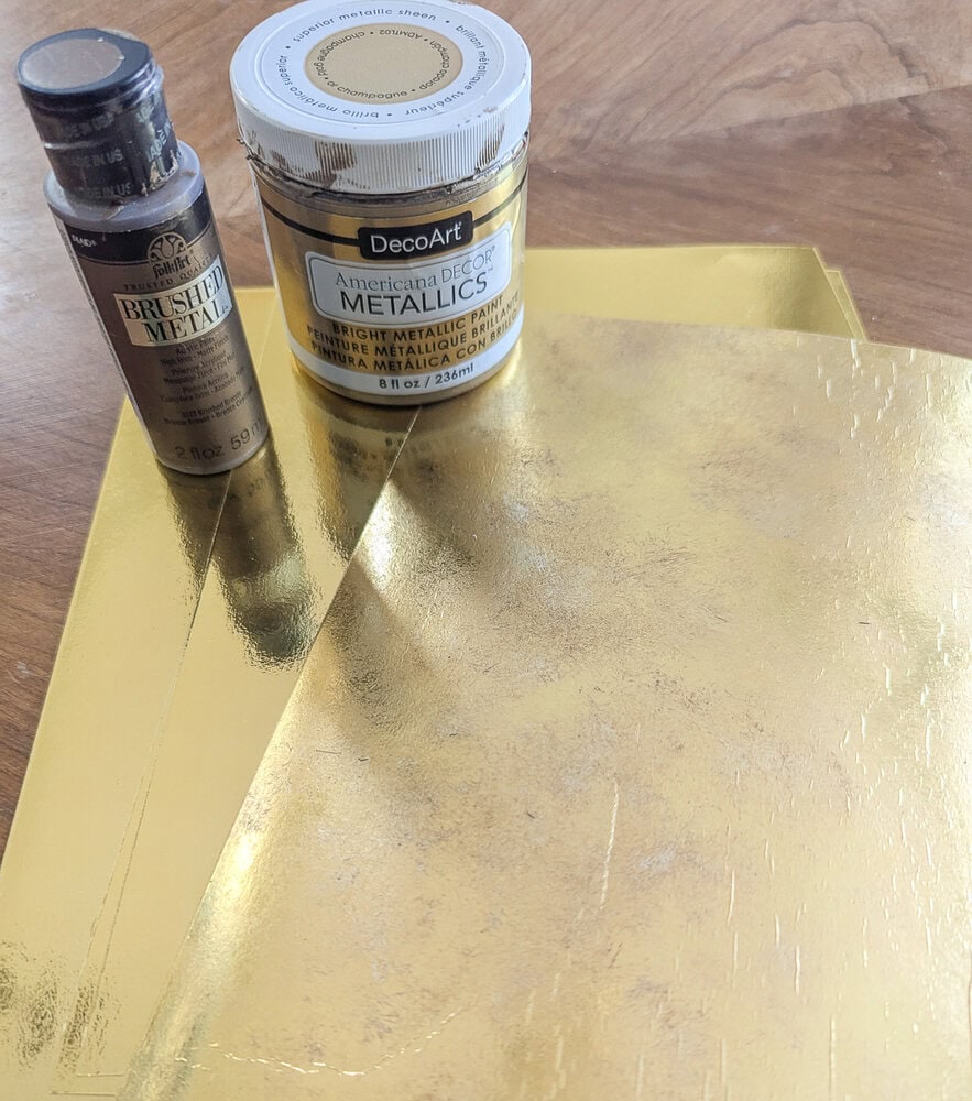 paints and gold foil cardstock.