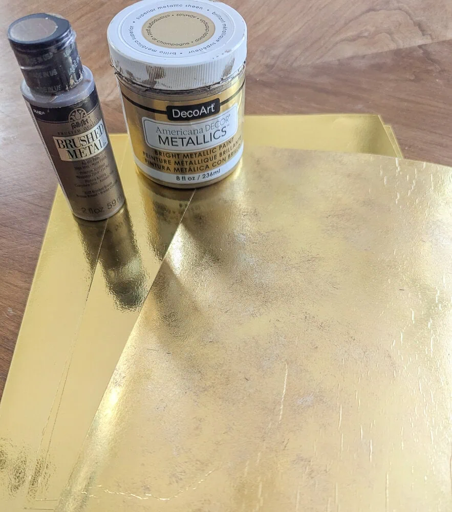 paints and gold foil cardstock.