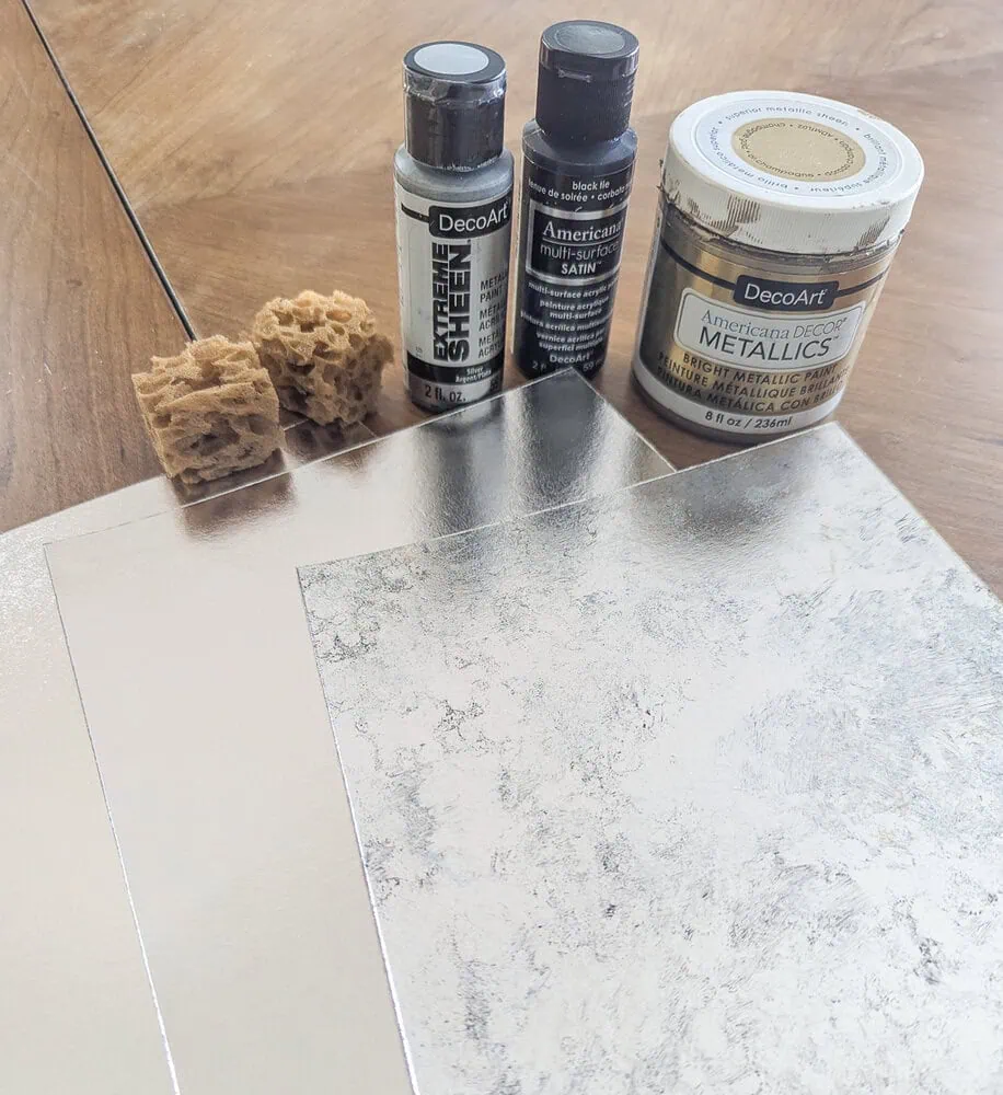 paints, sea sponge, and silver foil cardstock.