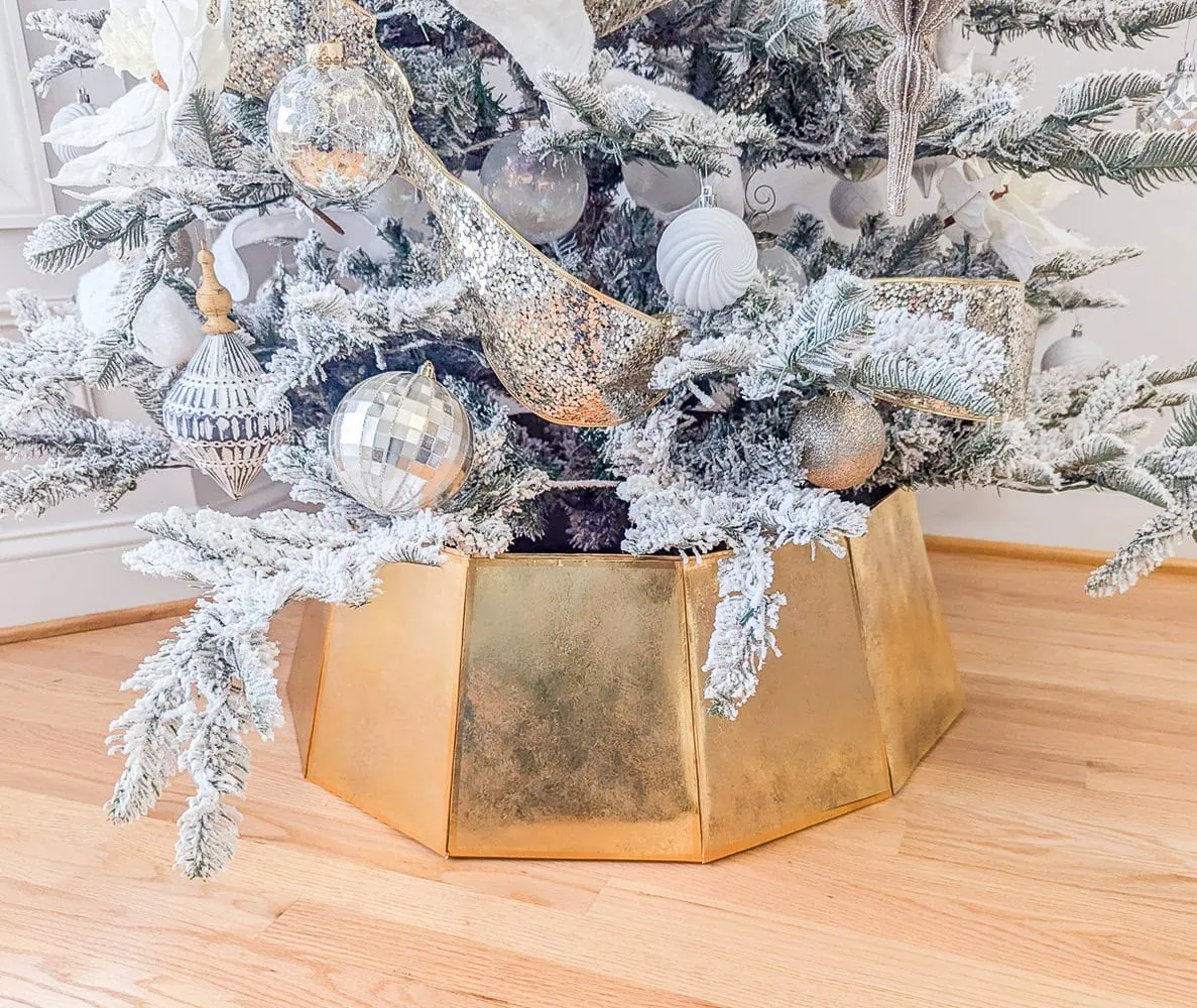 Christmas tree with gold Christmas tree collar.