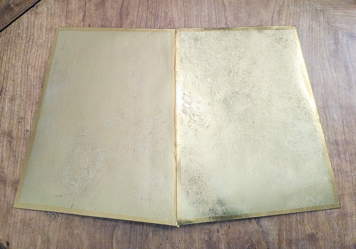 two gold sections taped together.