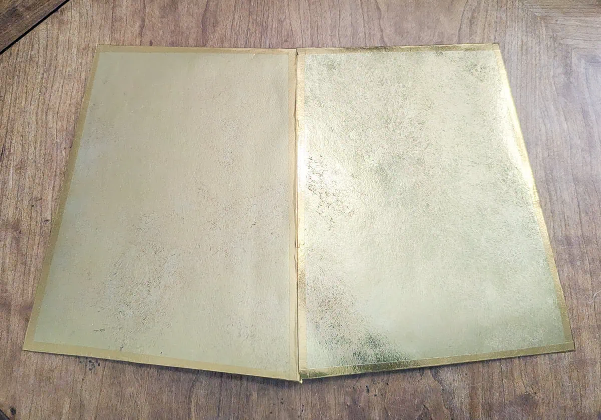two gold sections taped together.