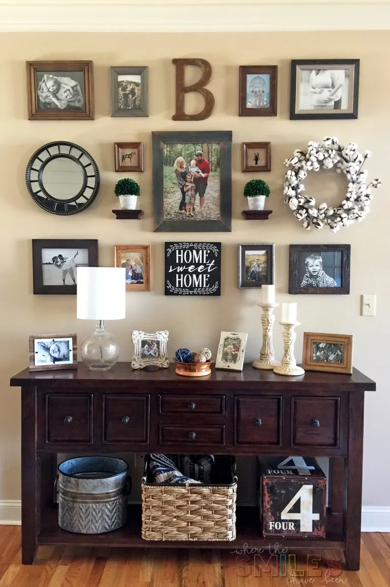gallery wall with a mix of family photos, wreaths and greenery