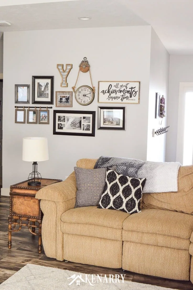 gallery wall with eclectic frame, sign, and clock.