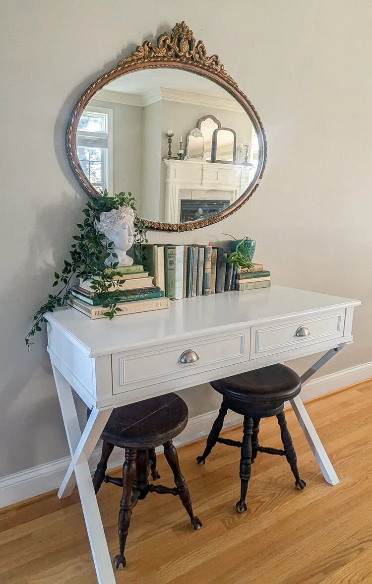 white table with gold antique mirror.