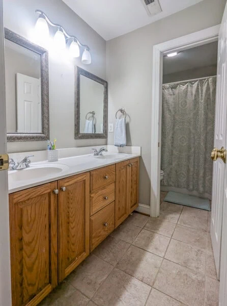 bathroom with double vanity.