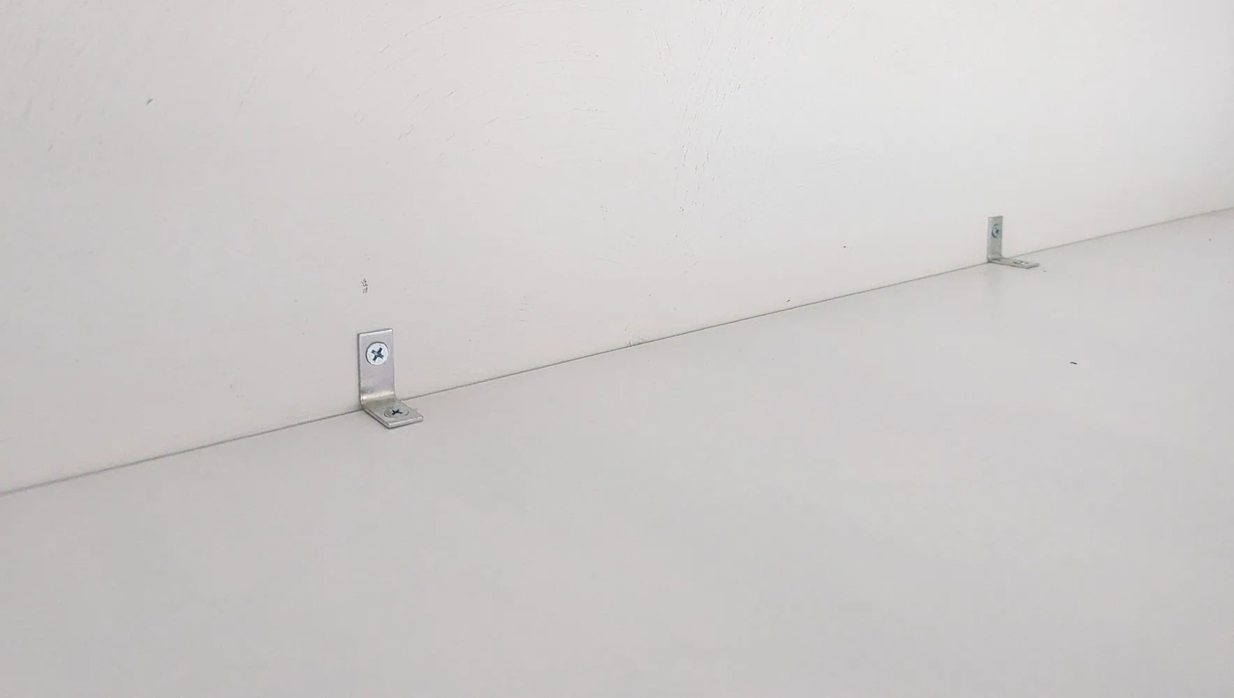 top shelf anchored to wall.