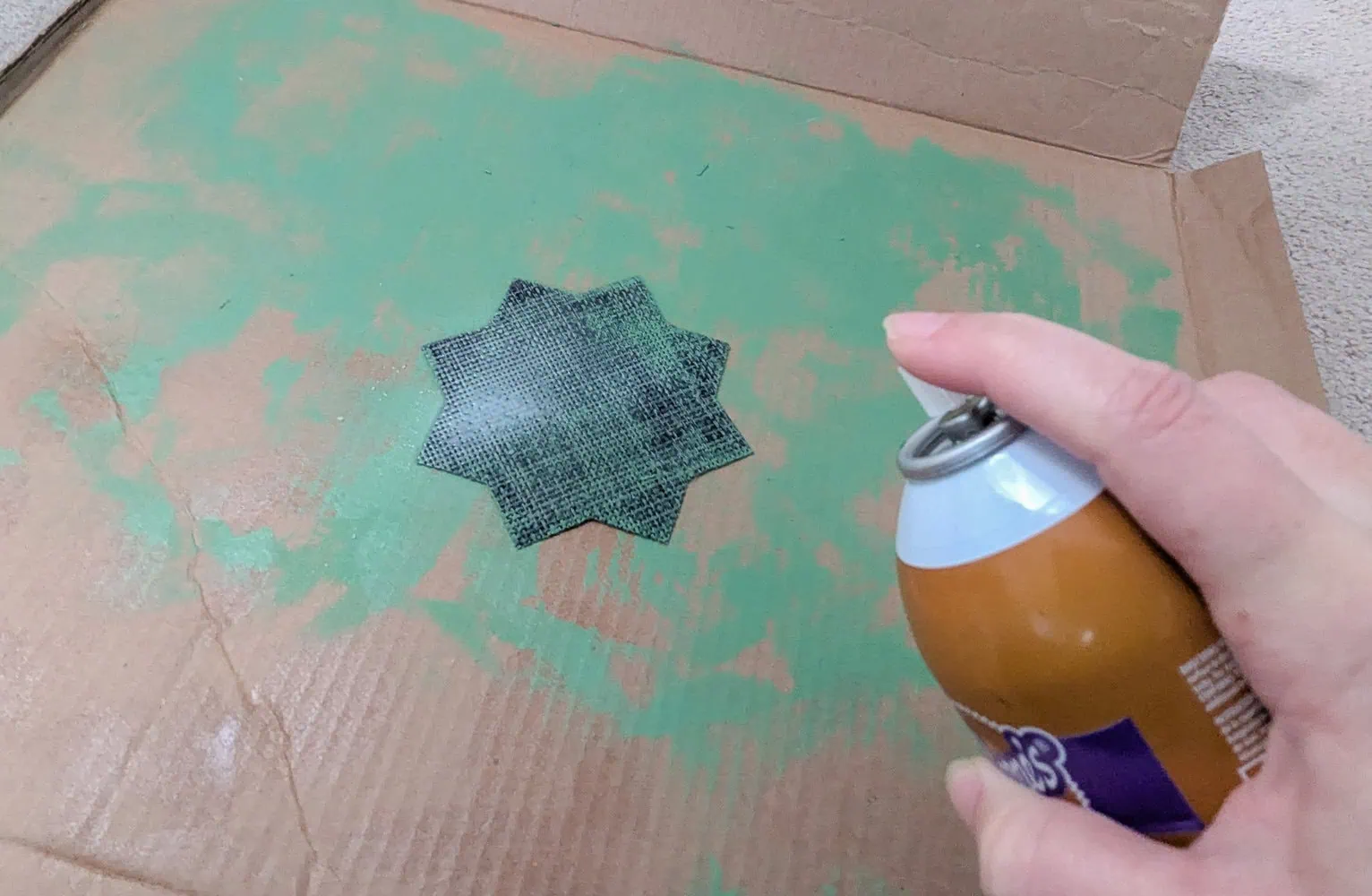 attaching the placemat pieces with spray adhesive.