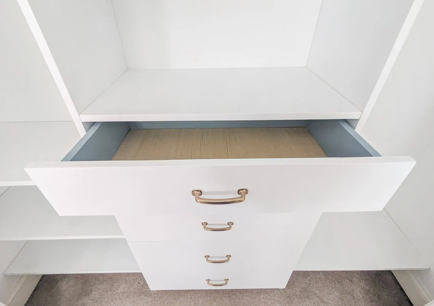 closet organizers with drawer handles installed.