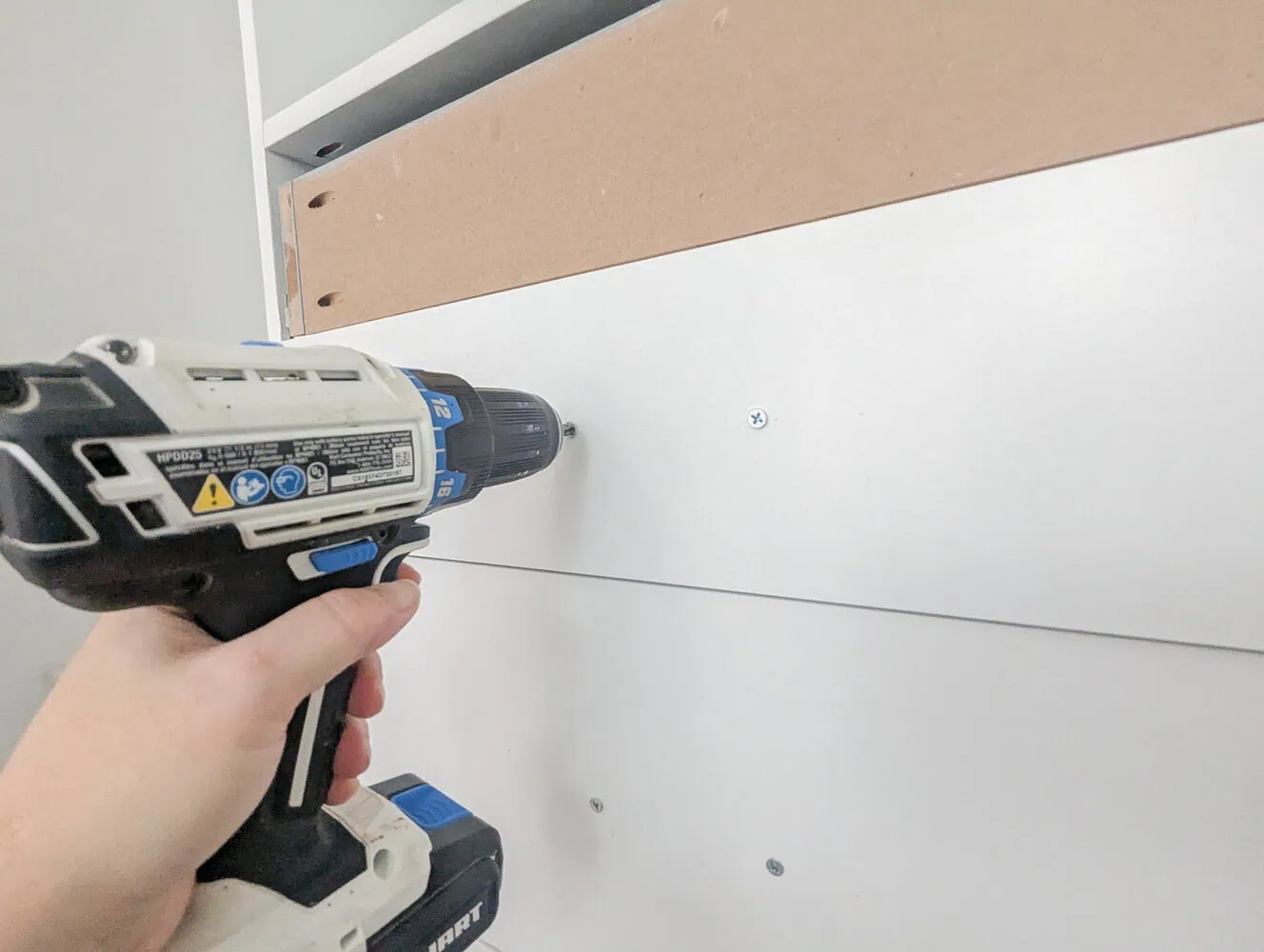 installing drawer fronts on drawers.