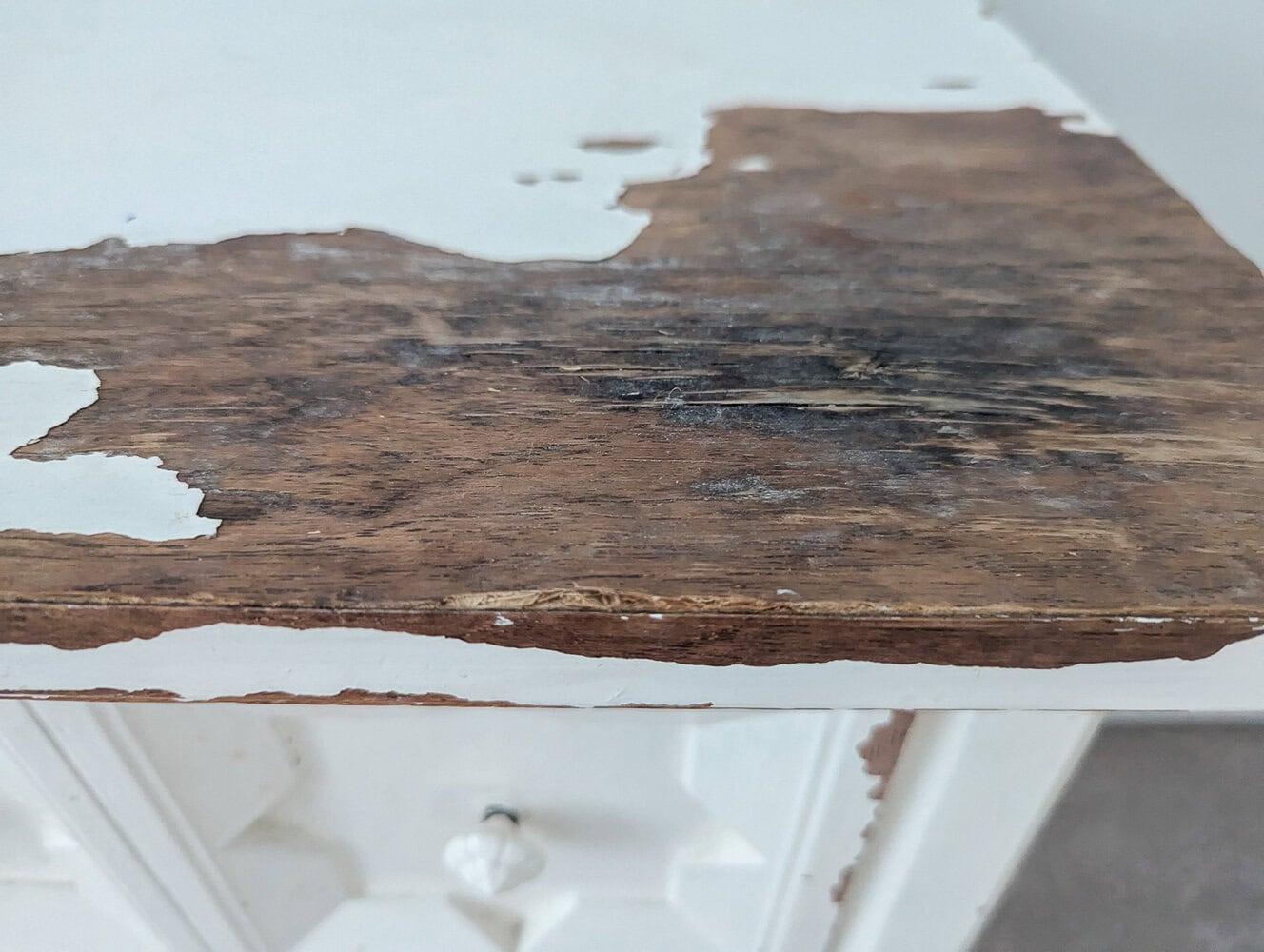 water damage on top of nightstand