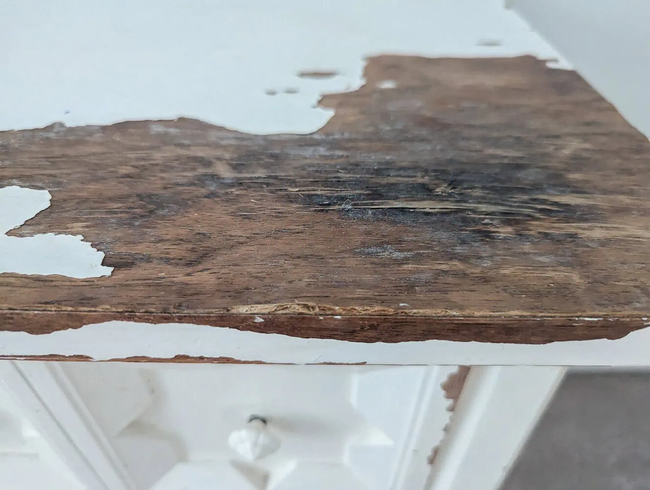 water damage on top of nightstand