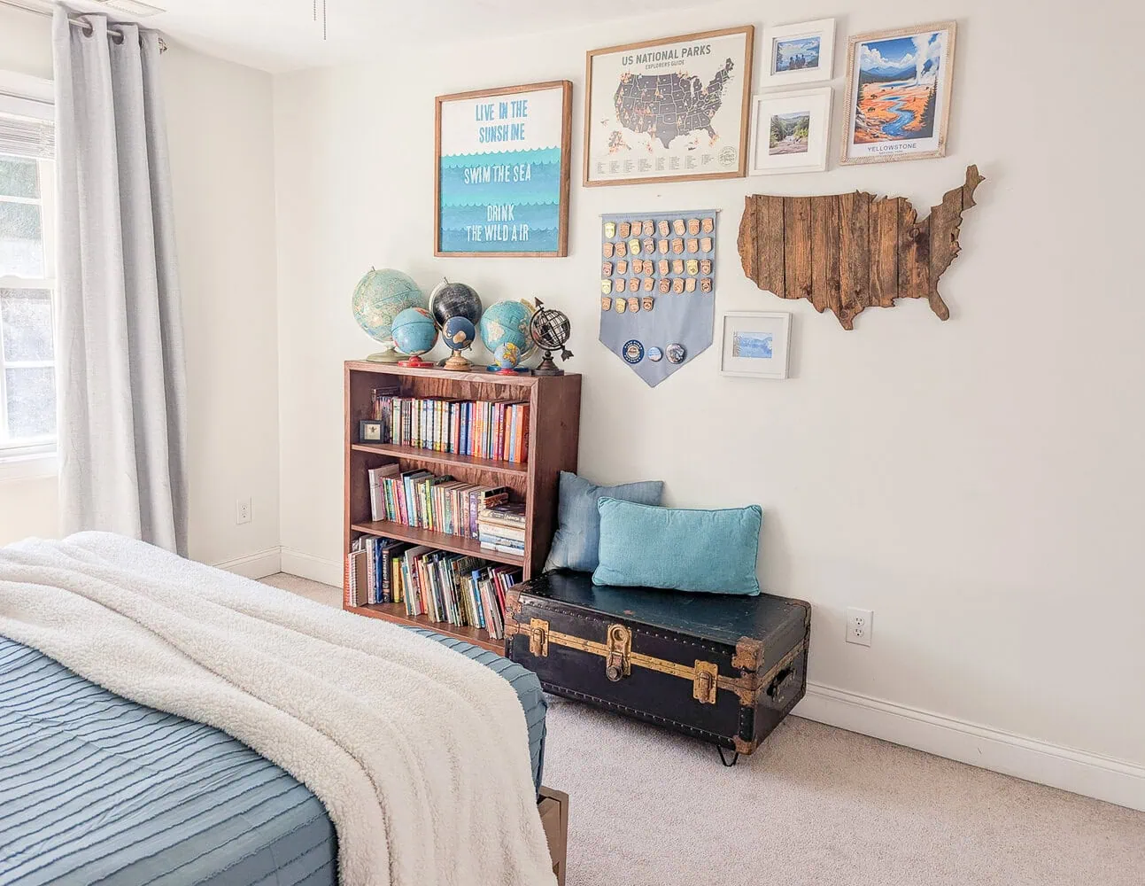 bookcase, vintage trunk, and gallery wall.