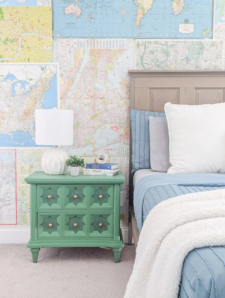 green nightstand against map wall.