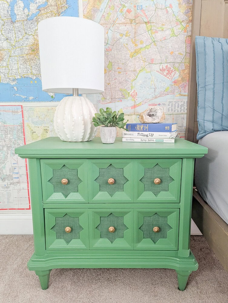 green nightstand with gold hardware.
