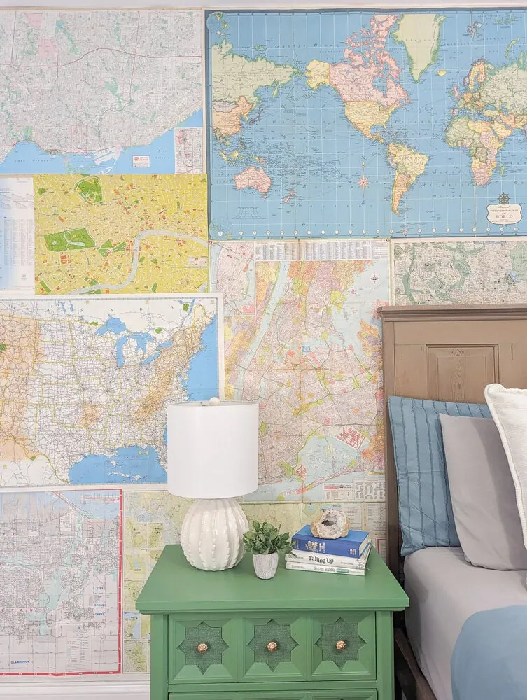 map wall with green nightstand.