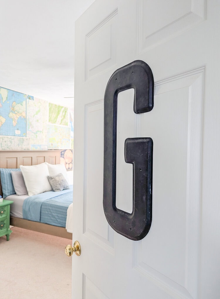 vintage G on door, peeking into bedroom.