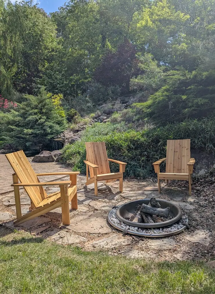 cedar adirondack chairs around fire pit.
