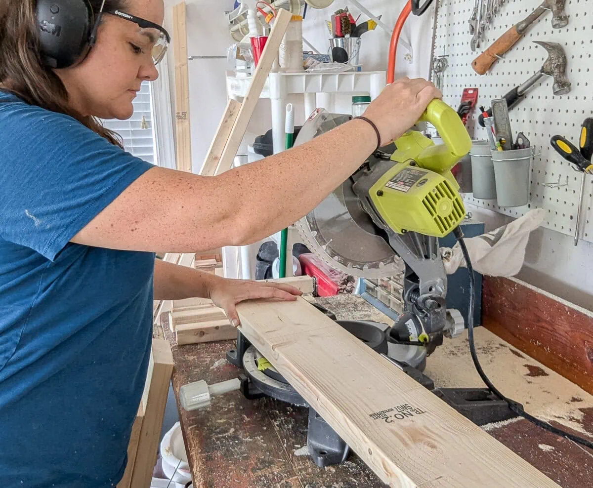 cutting wood with a miter saw.