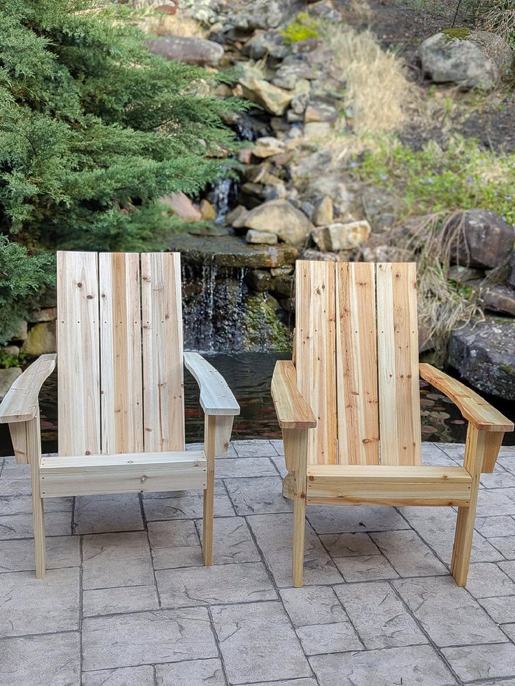 2 cedar adirondack chairs, one raw wood and one sealed with wood oil.