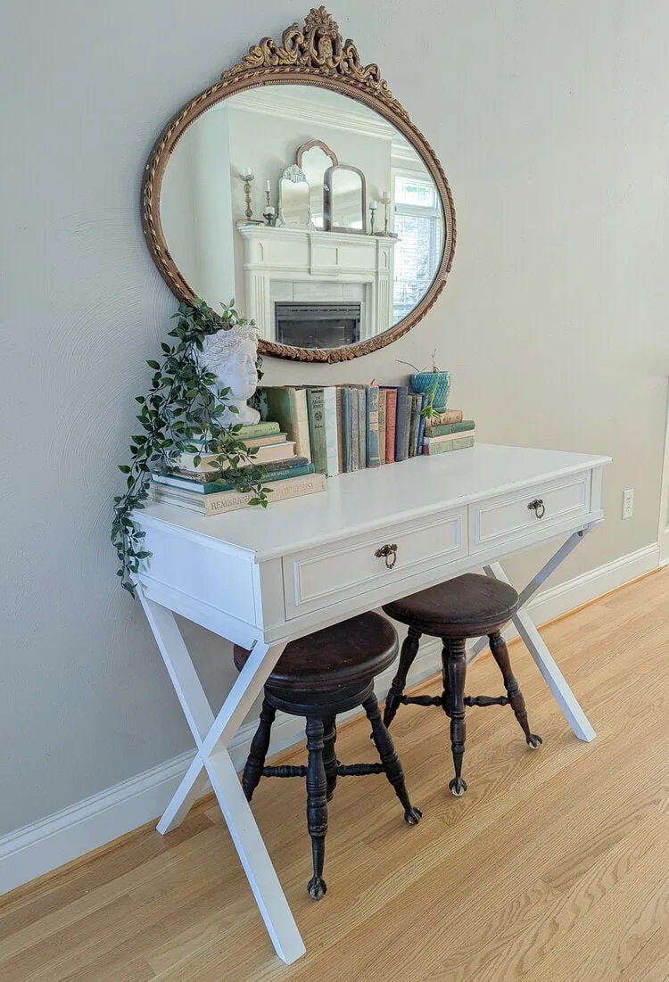 white desk with gold antique mirror and antique brass hardware.